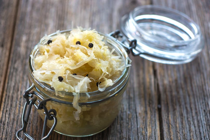 Sauerkraut in a jar on a table